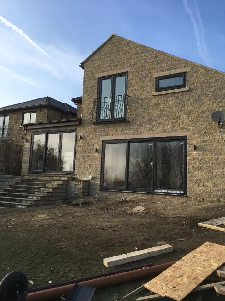 a house that is being built in the middle of the day